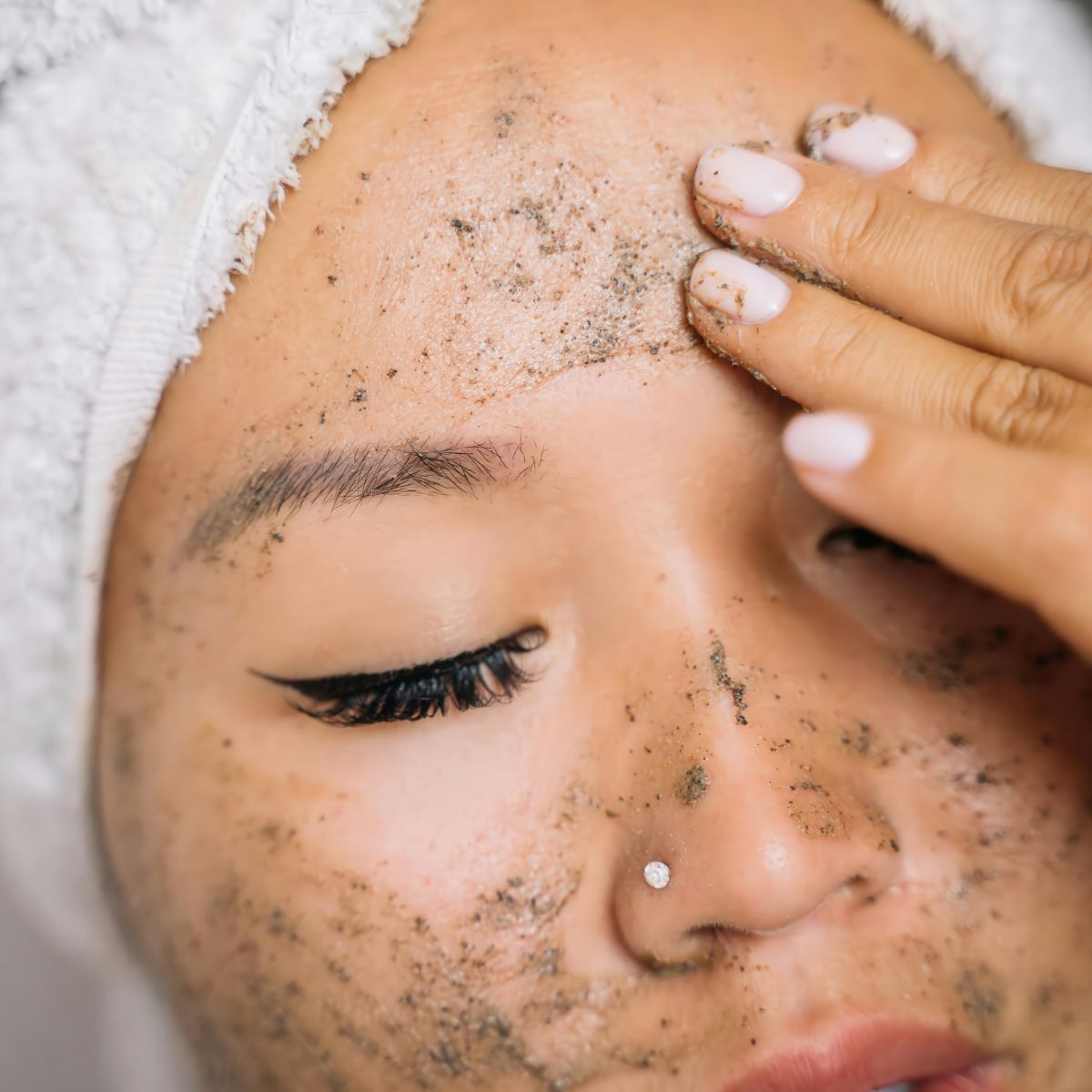 Woman with Exfoliant on her face