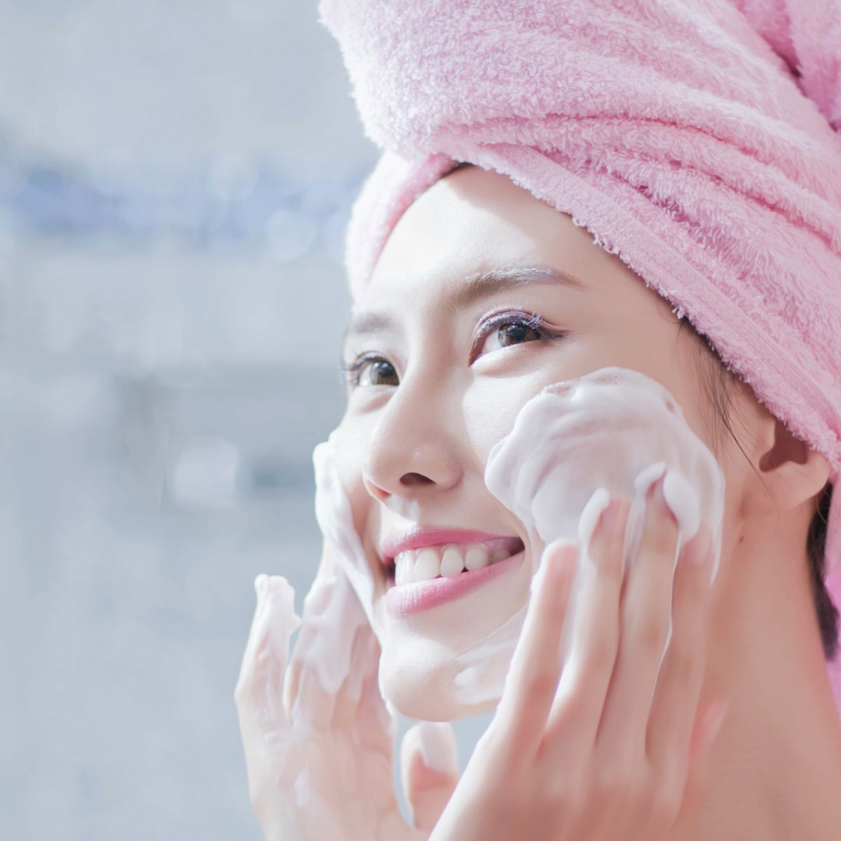 Woman Cleansing Face