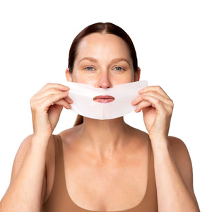 Woman holding the bottom part of the OmniLux Hydrogel Sheet Mask with a white background