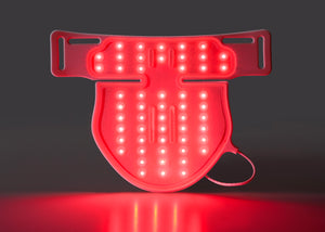 Red LED safety light on a black background